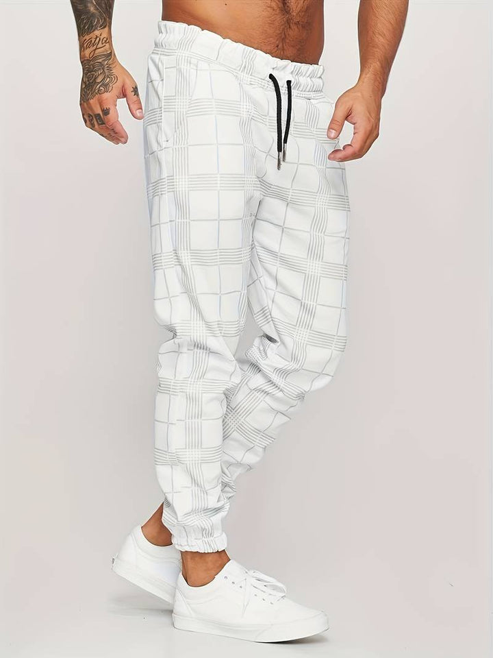 Man wearing white modern checked jogger pants with black drawstring