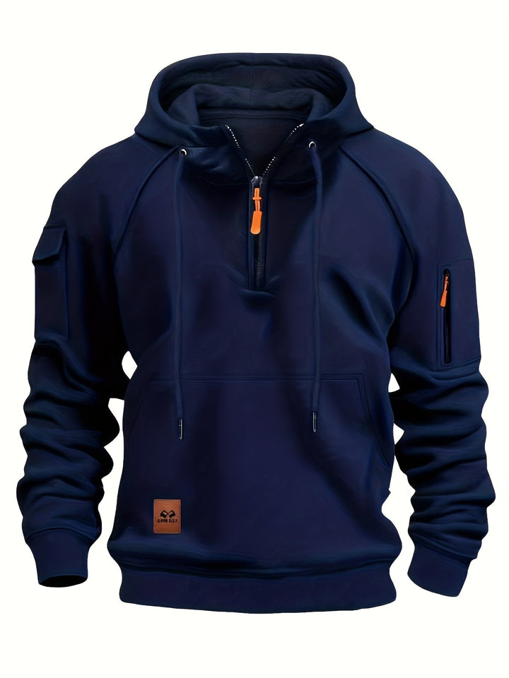 Quarter-zip hoodie for men shown hanging on a rustic wooden hook.