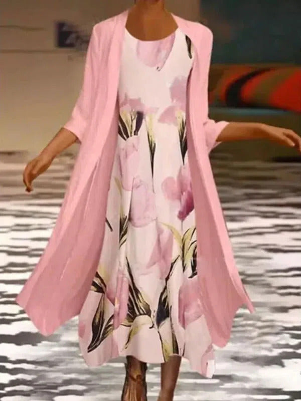 Women wearing a pink floral midi dress and matching cardigan set