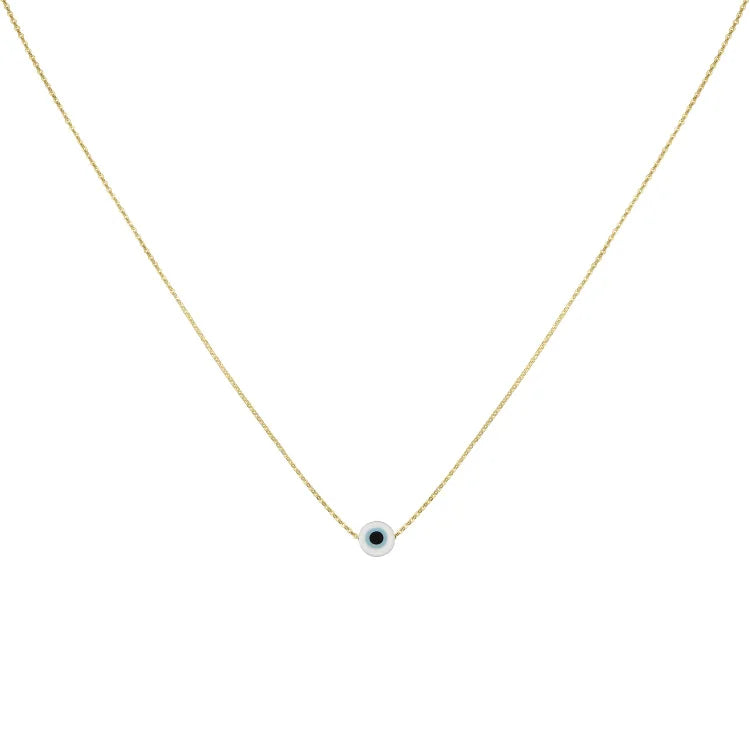 White evil eye charm necklace with gold chain displayed flat