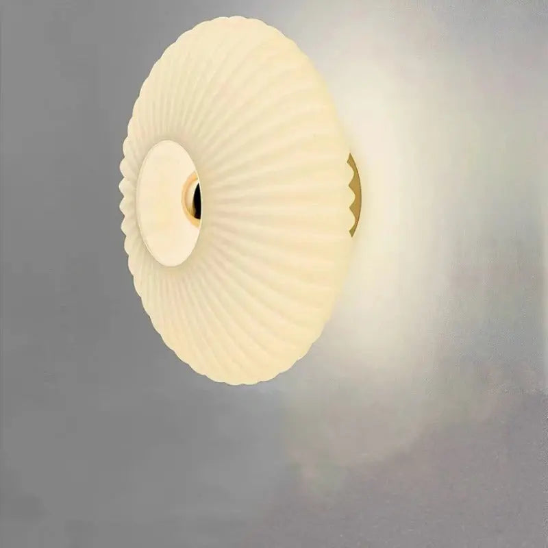 Stylish bedside lighting featuring a globe glass wall lamp design