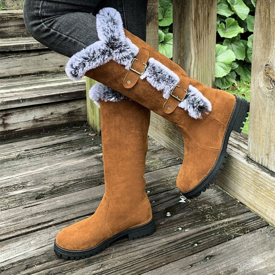 Close-up of decorative side buckles on womens casual knee-high boots