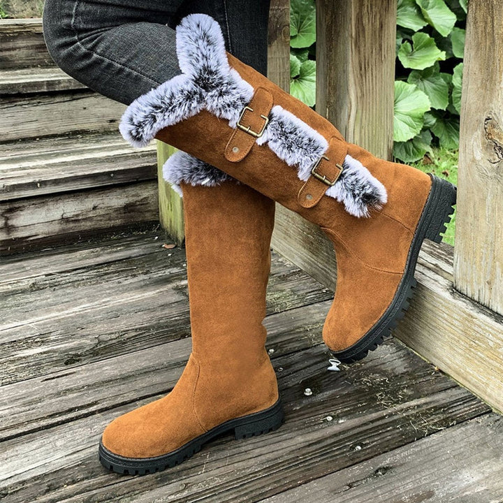 Close-up of decorative side buckles on womens casual knee-high boots