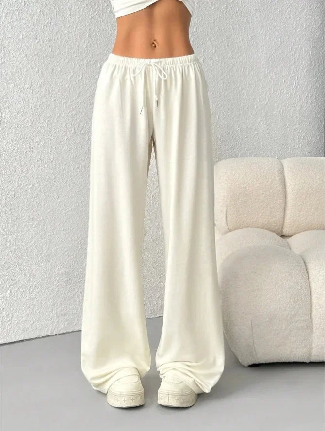 Side view of women's comfortable wide-leg lounge pants styled for everyday wear.