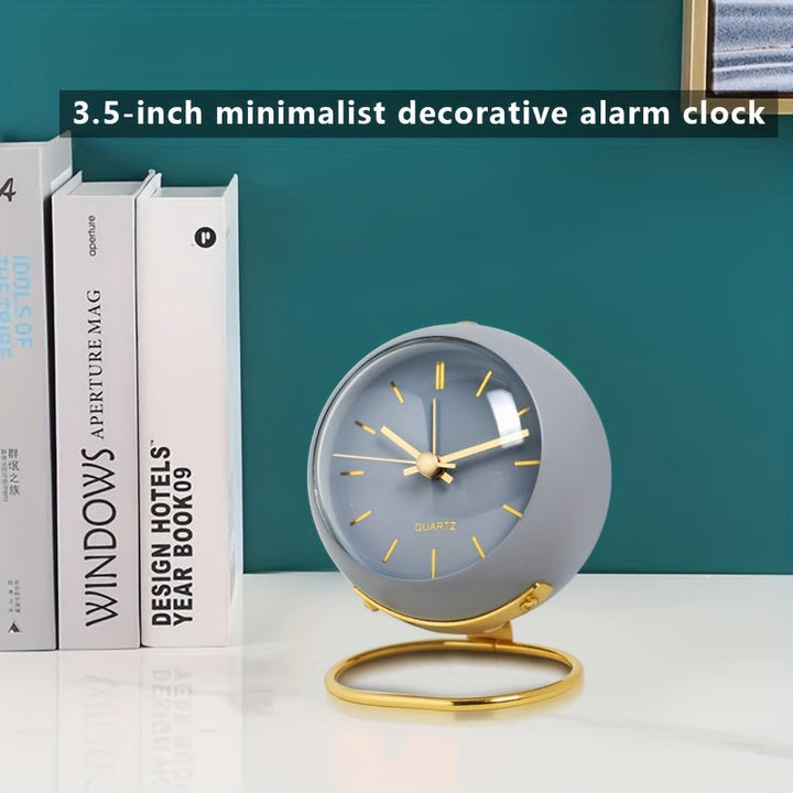 Grey minimalist desk clock displayed on a shelf next to books