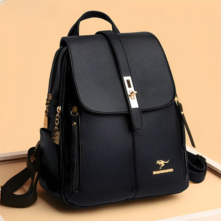Studio shot of the black Alena backpack featuring structured design and gold hardware