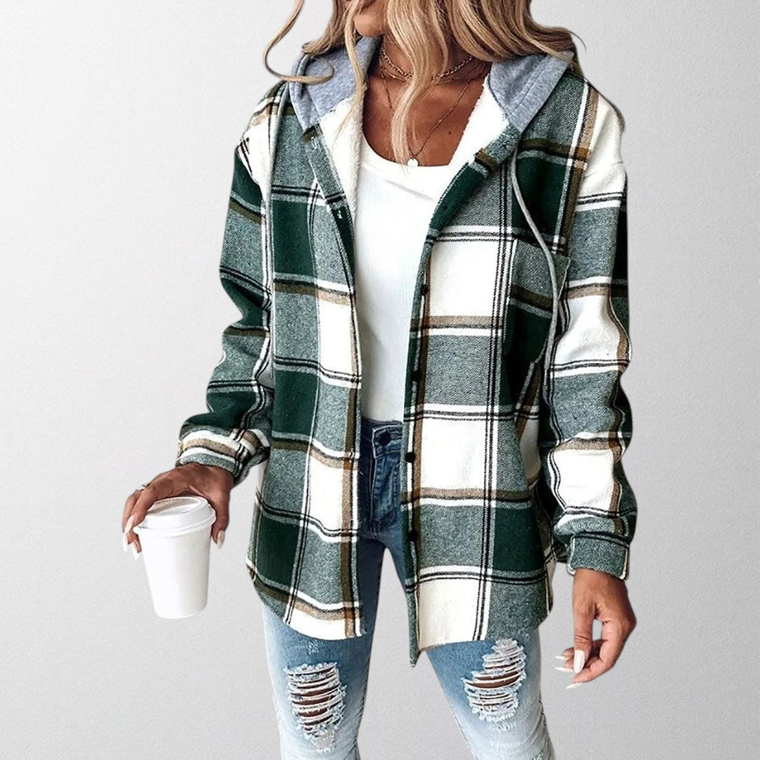 Woman wearing a green plaid hooded jacket with a cozy hood and casual silhouette