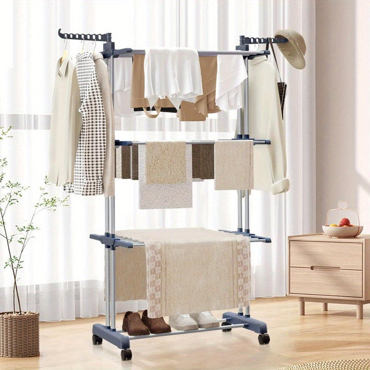 Foldable laundry drying rack placed in a bright living room setting