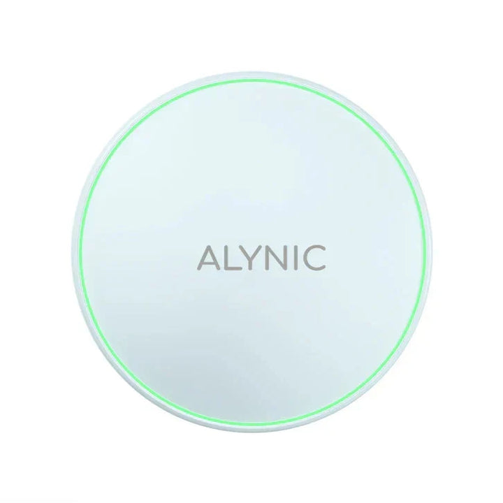 Side profile of ultra thin fast charger pad on glass surface
