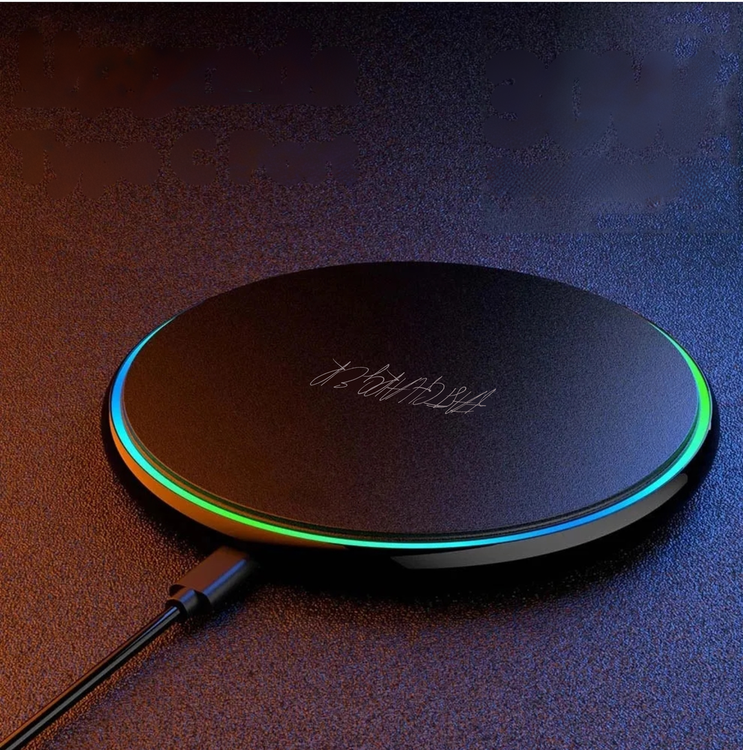 Black 30W fast wireless charging pad with glowing LED ring on dark surface