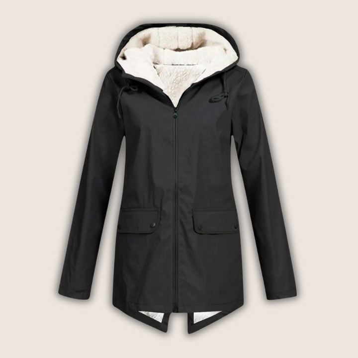 Close-up detail of the waterproof zipper and taped seams on the rain coat