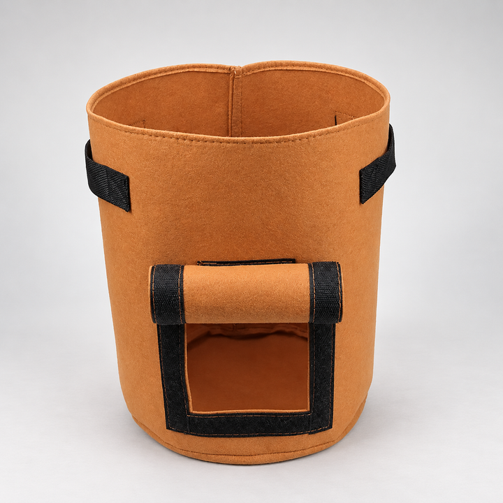 Brown fabric vegetable growing bag with side harvest window against a white background