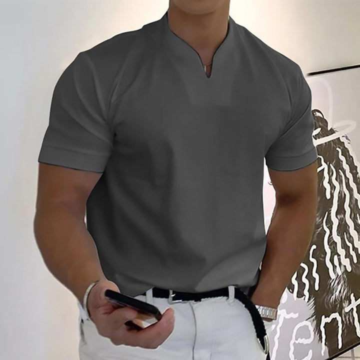 Men's apparel polo shirt styled with casual trousers for a smart look