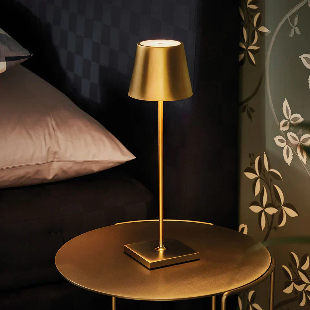 Modern cordless lamp placed on an outdoor patio dining table