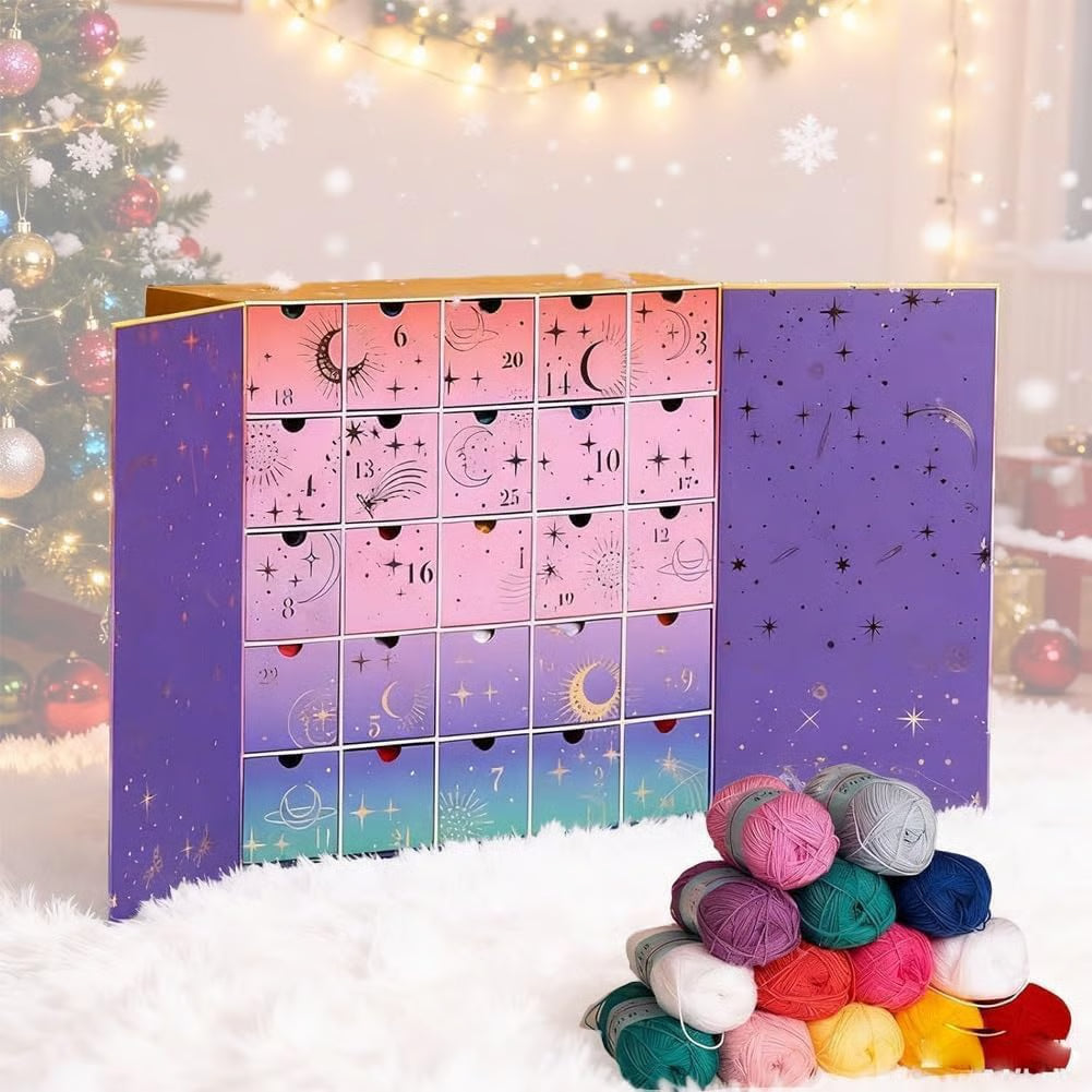 Crochet advent calendar box opened next to a colorful pile of yarn skeins.