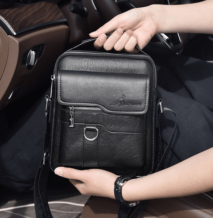Side view of mens waterproof black shoulder utility bag showing slim profile