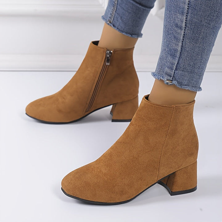 Detailed shot of elastic gore and pull tab on womens footwear