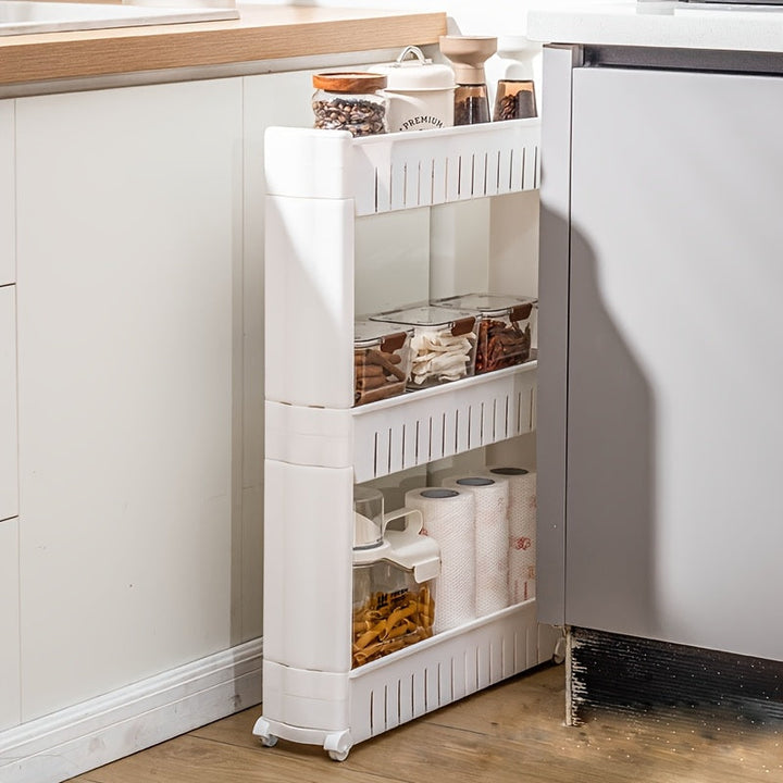 3-tier storage trolley filled with paper towels and pantry items in a kitchen