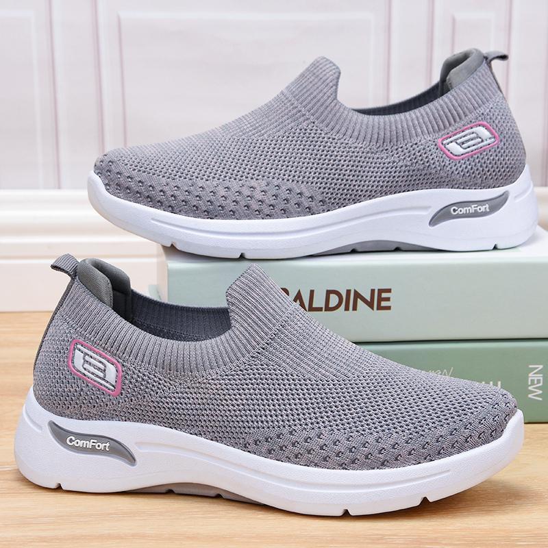 Side view of women's orthopedic walking sports shoes showing arch support design