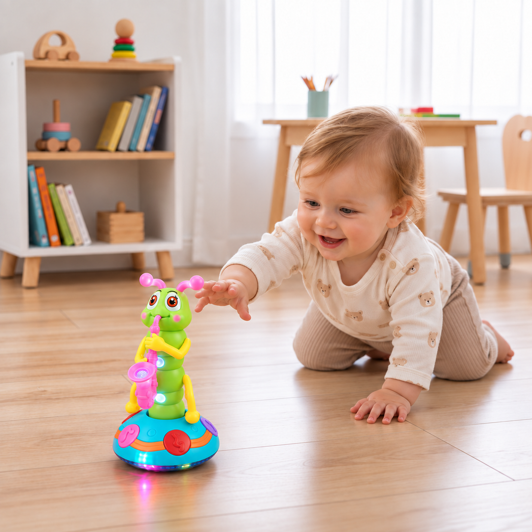 Toddler playing with a colorful musical dancing caterpillar toy on a wooden floor