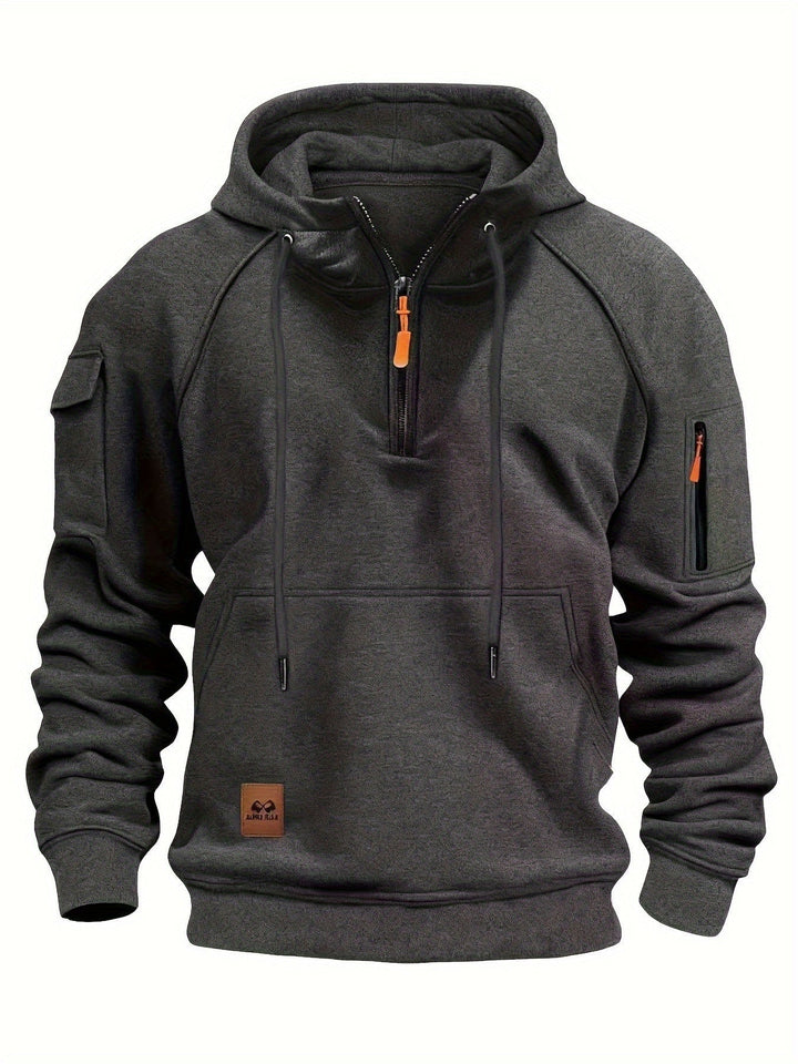 Lifestyle shot of men's casual quarter-zip hoodie in urban setting.