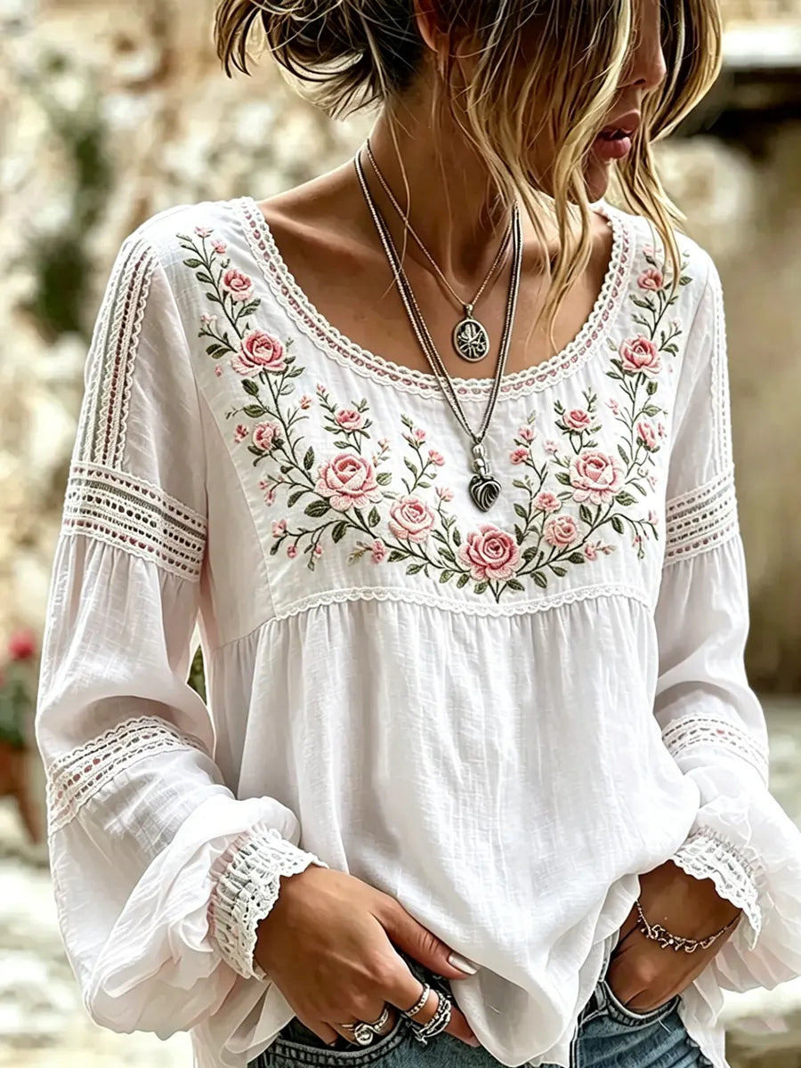 Stylized flat lay of the embroidered top paired with casual wear accessories