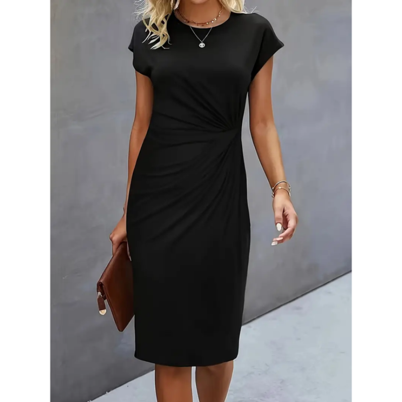 Woman wearing a black short sleeve midi dress with gathered waist detail