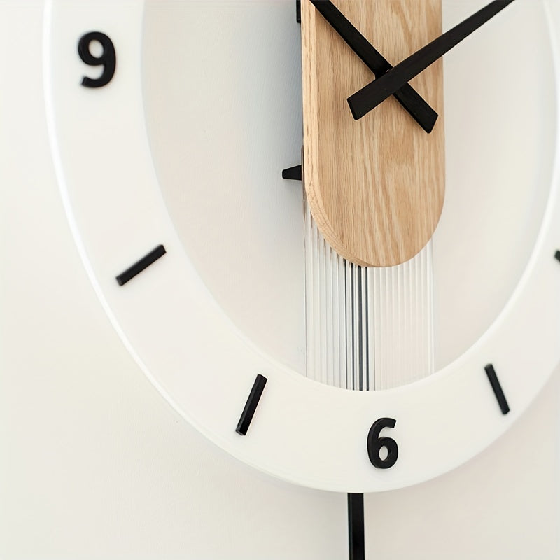 Modern wooden and acrylic silent pendulum wall clock hanging on a living room wall