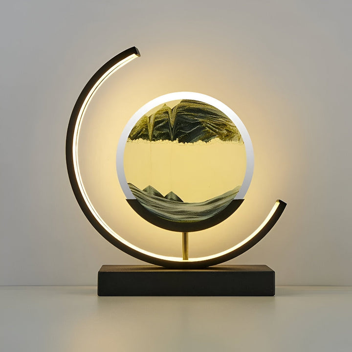 Decorative moving sand art table lamp casting a warm glow on a nightstand