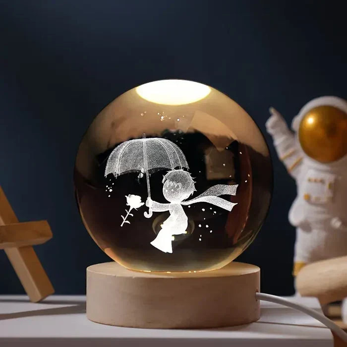 Detailed miniature galaxy laser engraved inside a clear crystal sphere night light