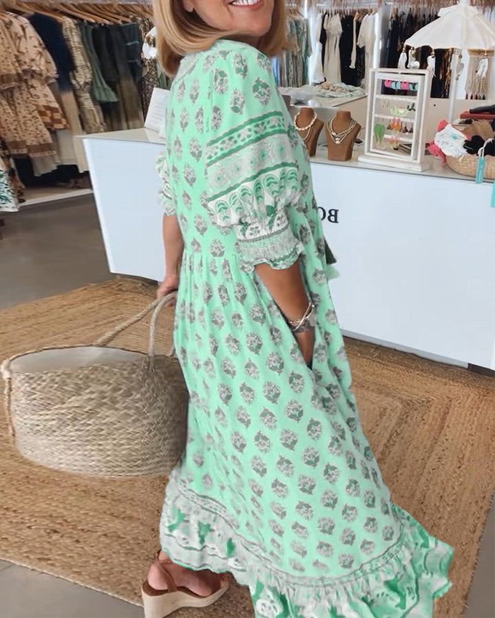 Back view showing the fit of the green and pink printed dress