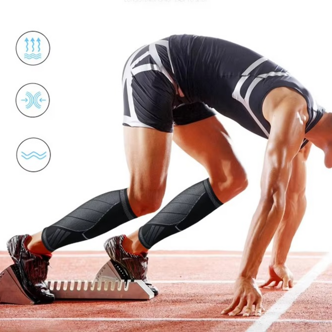 Athlete wearing black compression calf sleeves in starting blocks