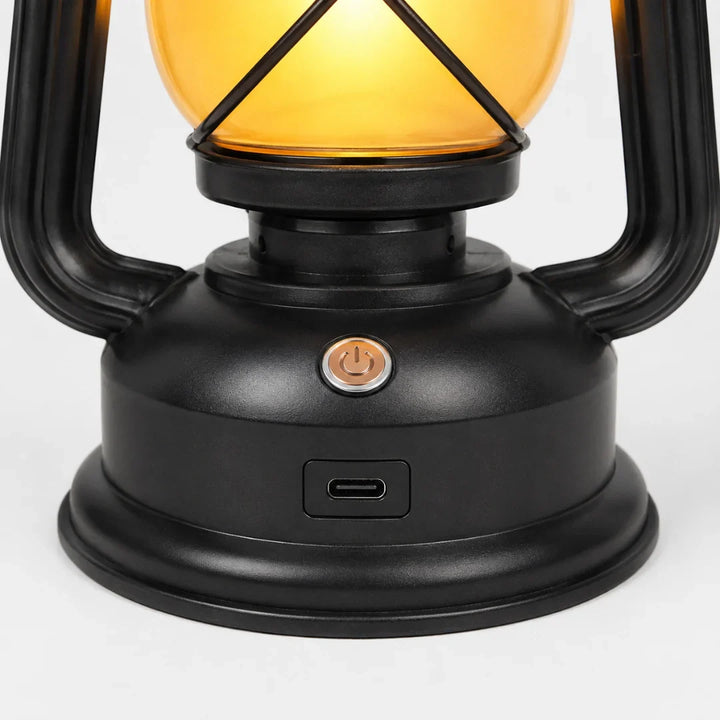 Vintage flame effect LED camping lantern glowing warmly for outdoor lighting and patio decor