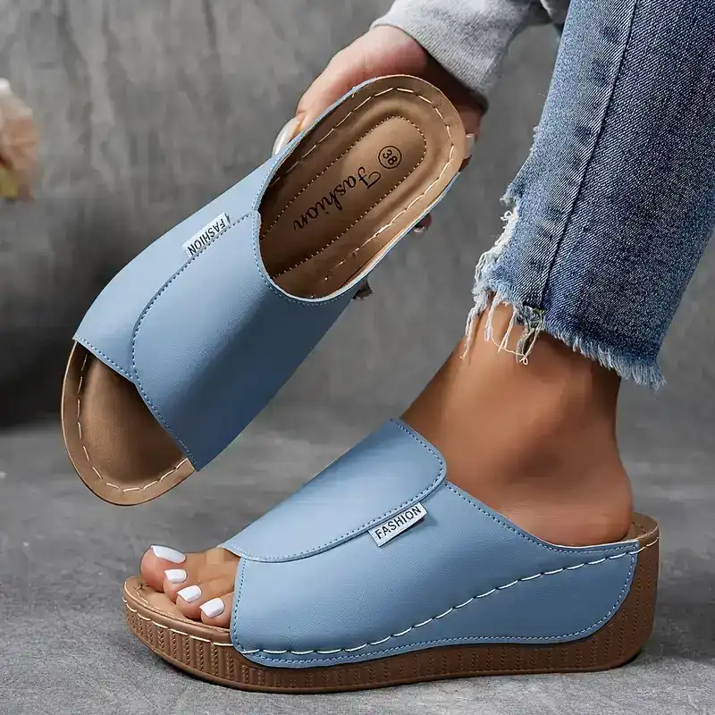 Back view of comfortable orthopedic sandals featuring a supportive wedge heel.