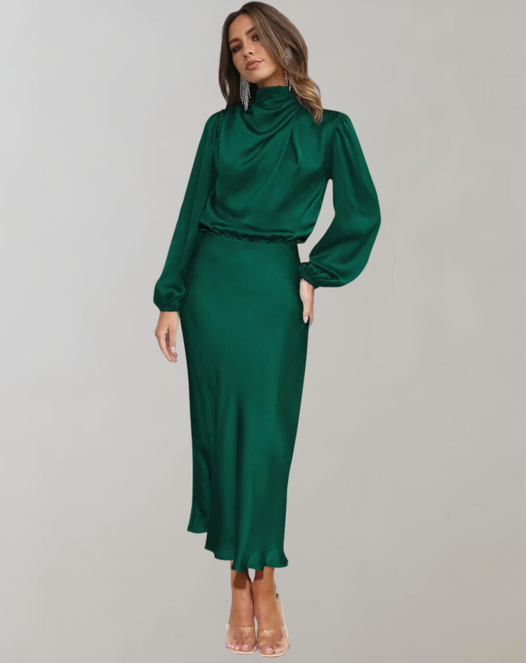 Model wearing dark green long sleeved satin dress