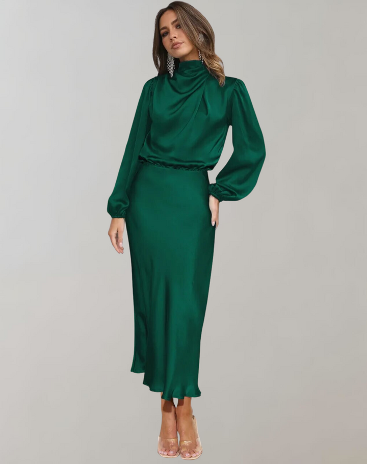 Model wearing dark green long sleeved satin dress