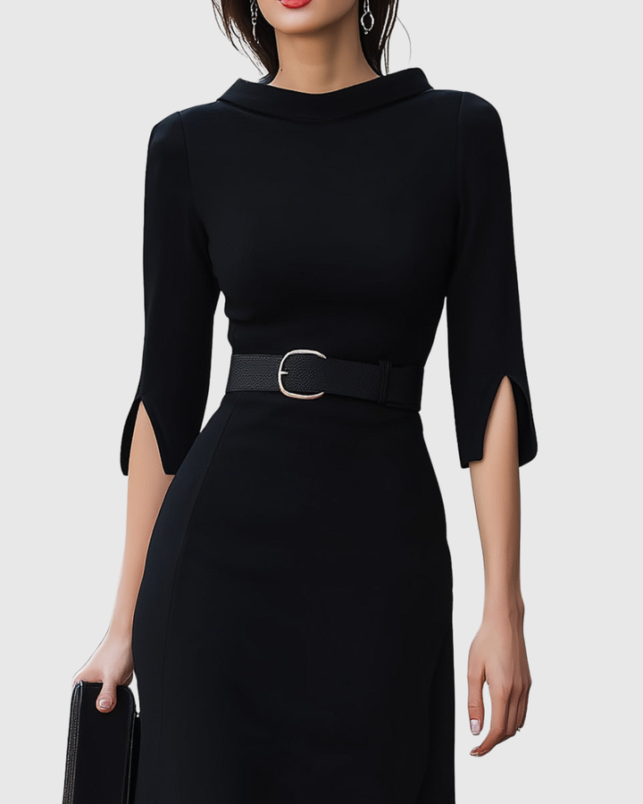 Close-up of high neck and belted waist detail on women's black midi dress