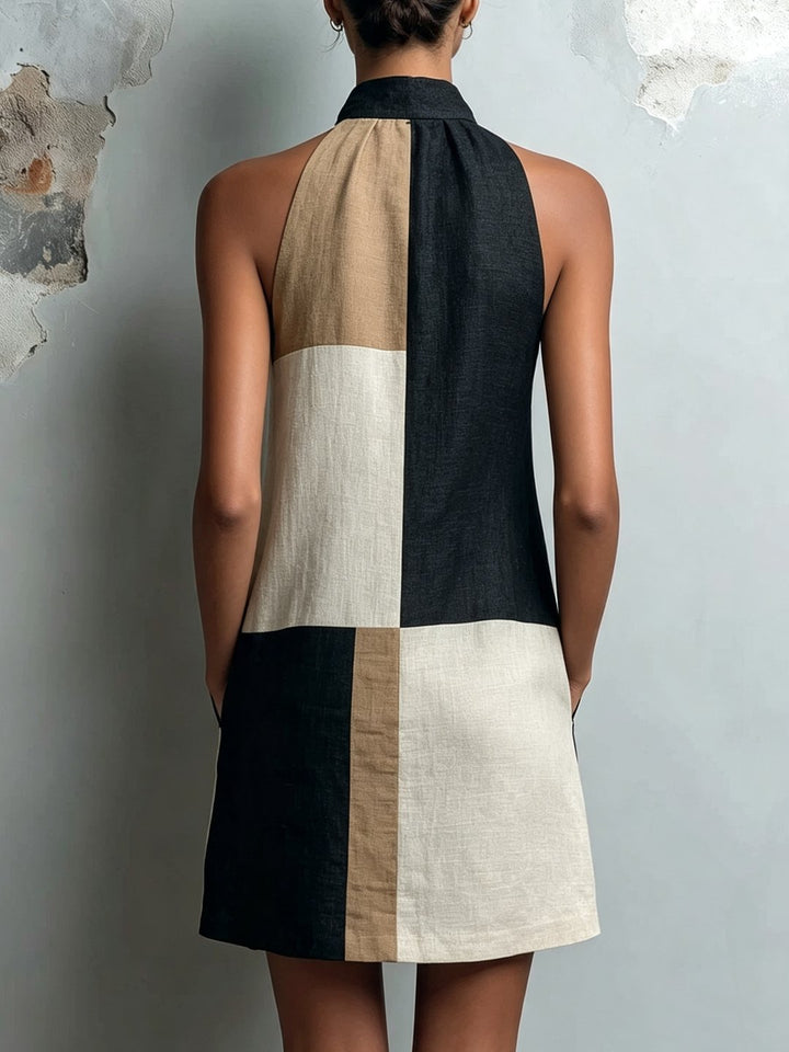 Back view of the colorblock halter mini dress showing the fit