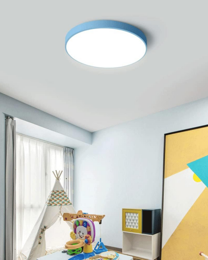 Modern lighting fixture featuring a flat circular disc design on white ceiling