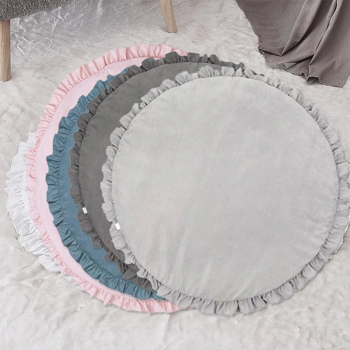 Blue round baby playmat styled for modern nursery interior design
