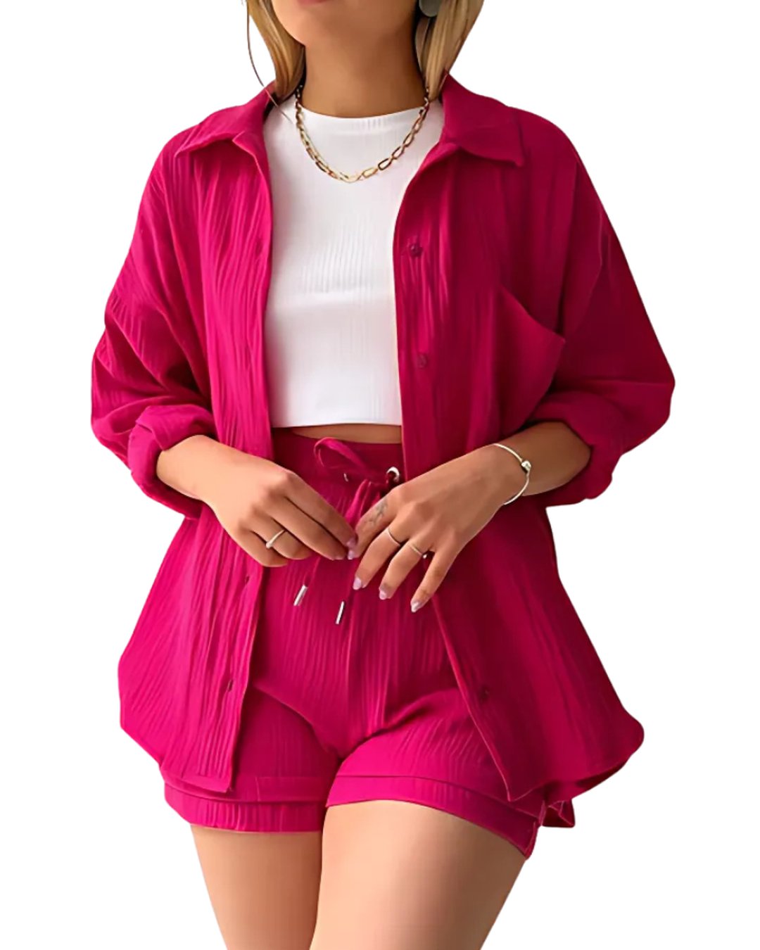 Woman wearing vibrant pink matching button-down shirt and shorts outfit
