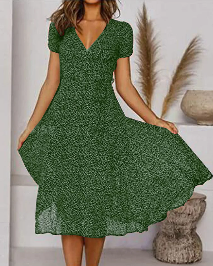 Woman wearing green V-neck puff sleeve midi dress