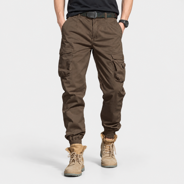 Detailed shot of reinforced knee stitching on men's outdoor utility pants