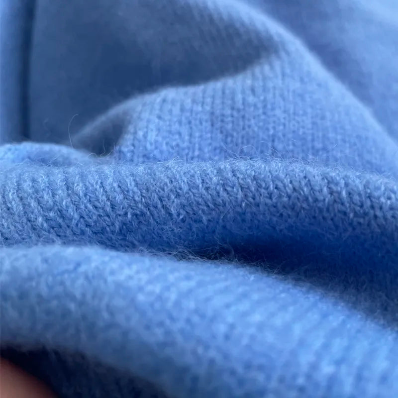 Side profile of the casual green knitwear showing relaxed oversized fit