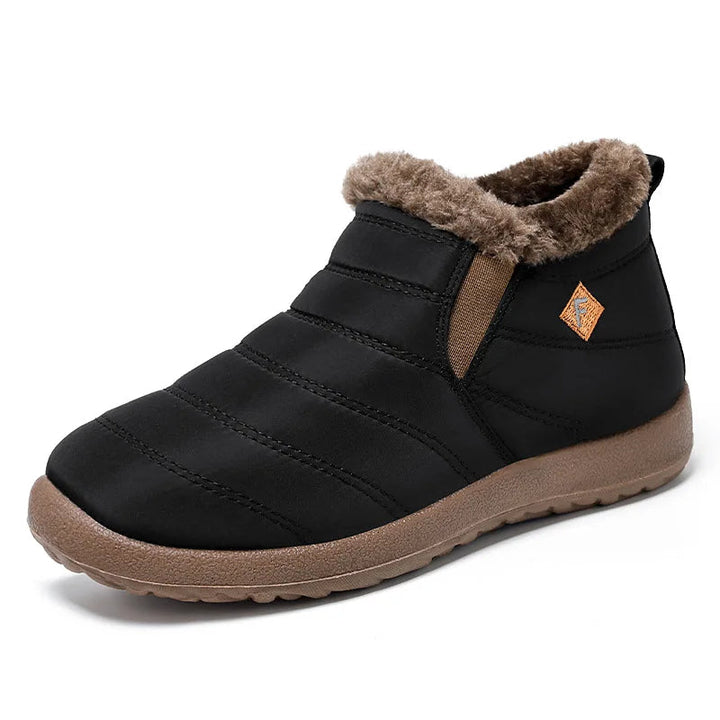 Side profile of black winter warm slip-on boot showing quilted exterior and cozy collar.