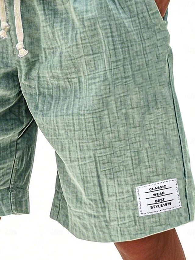 Close-up of men's casual green shorts showing texture and patch detail