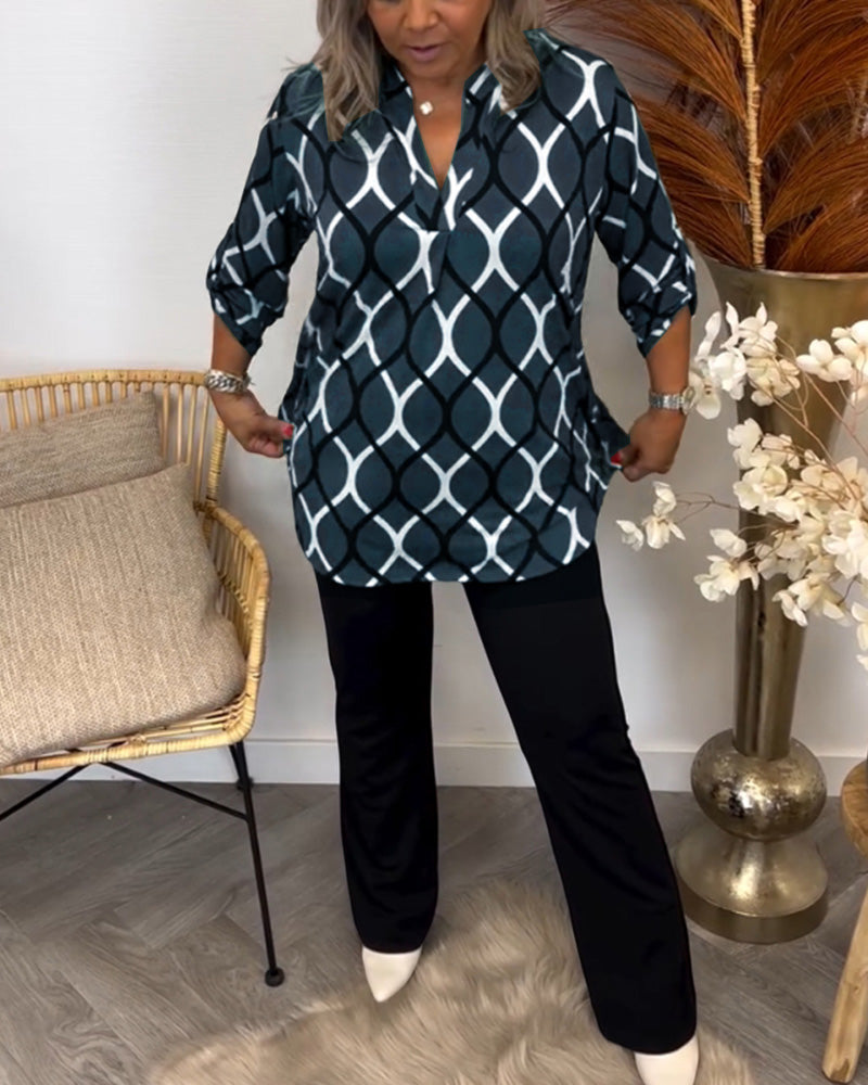 Detailed shot of the neckline on the casual women's patterned blouse