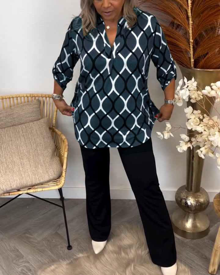 Detailed shot of the neckline on the casual women's patterned blouse