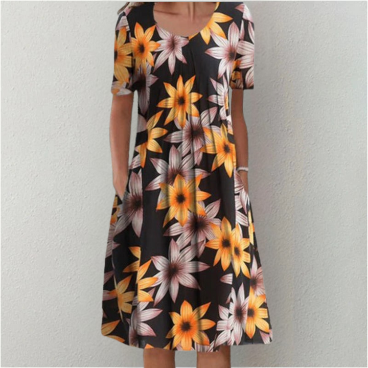Delightful womens summer midi dress featuring an eye-catching floral design.