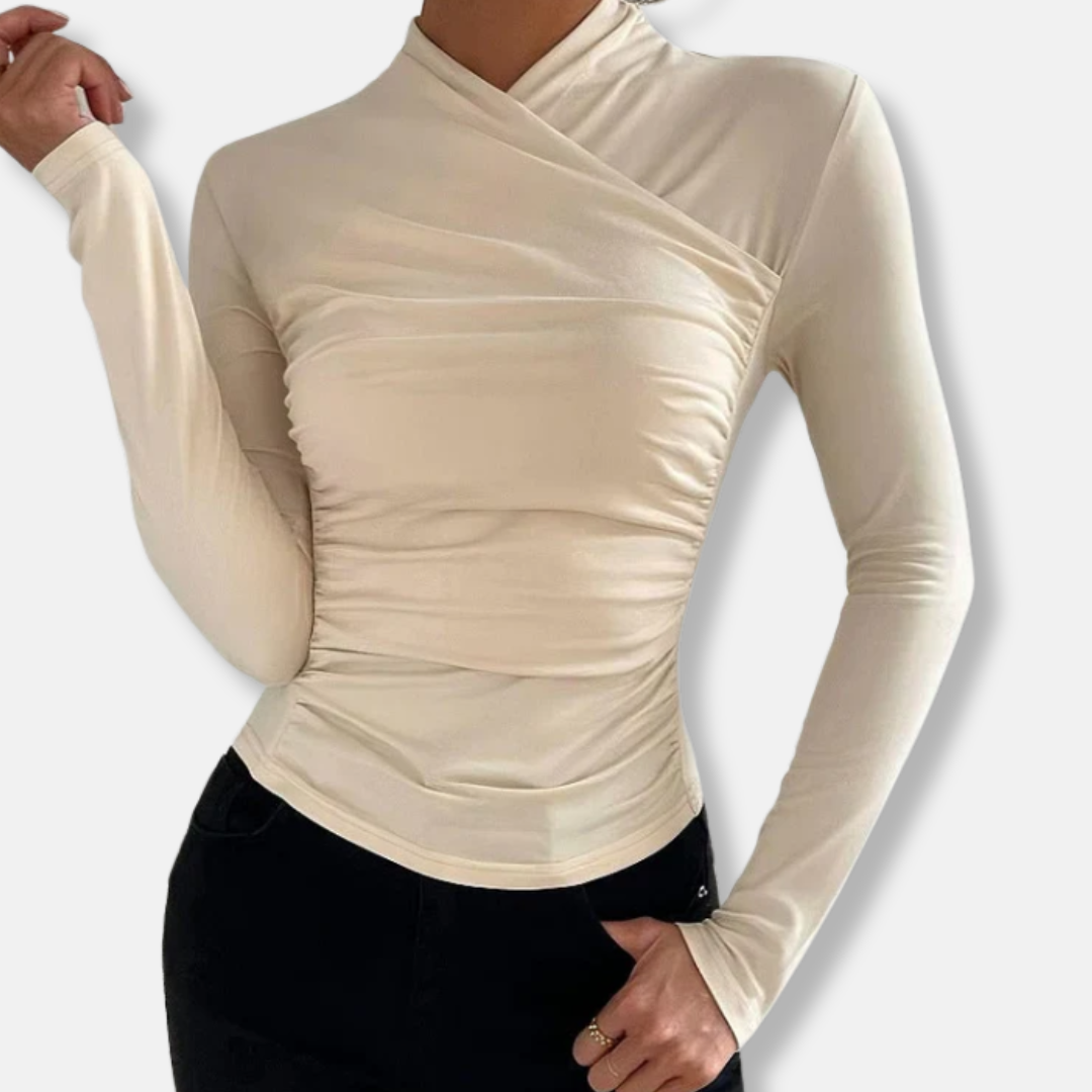 Woman wearing the cream asymmetric ruched high-neck long sleeve top